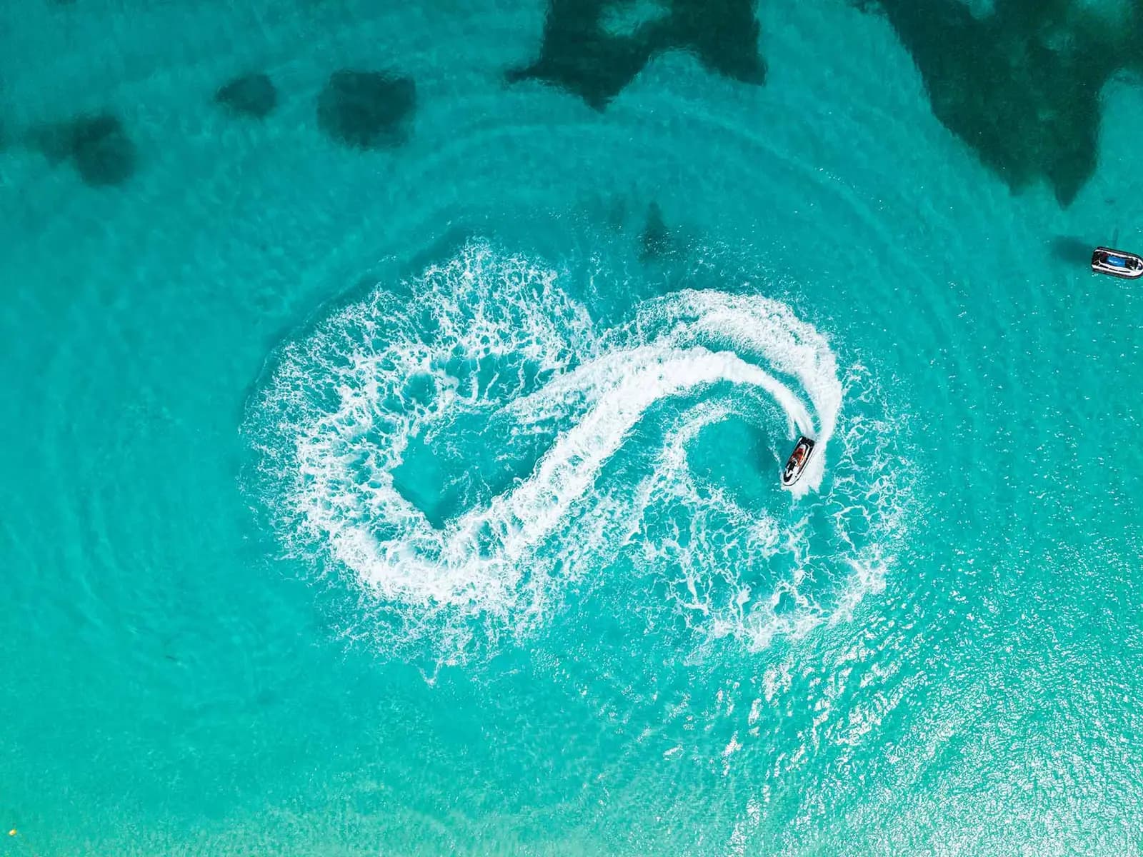 Flyboarder soaring above the water off the coast of Aruba